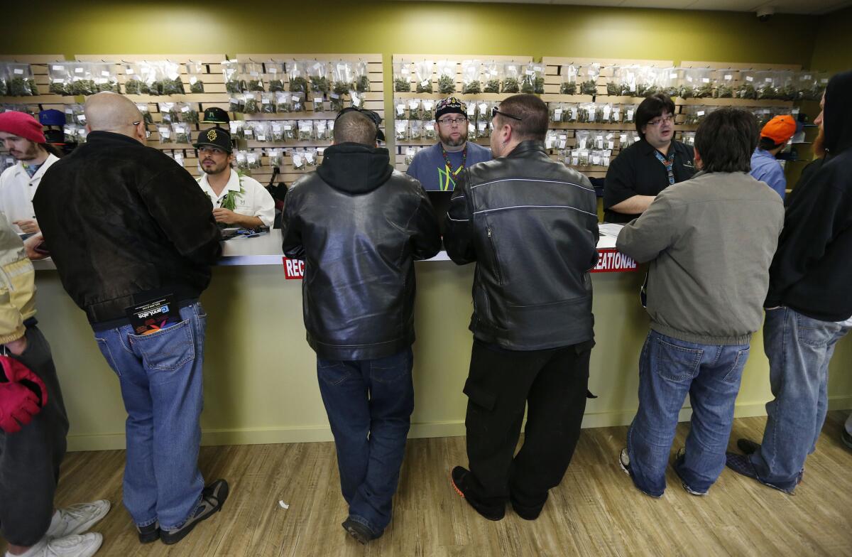 Customers on opening day in a marijuana retail store in Denver. Some people were calling it "Green Wednesday."