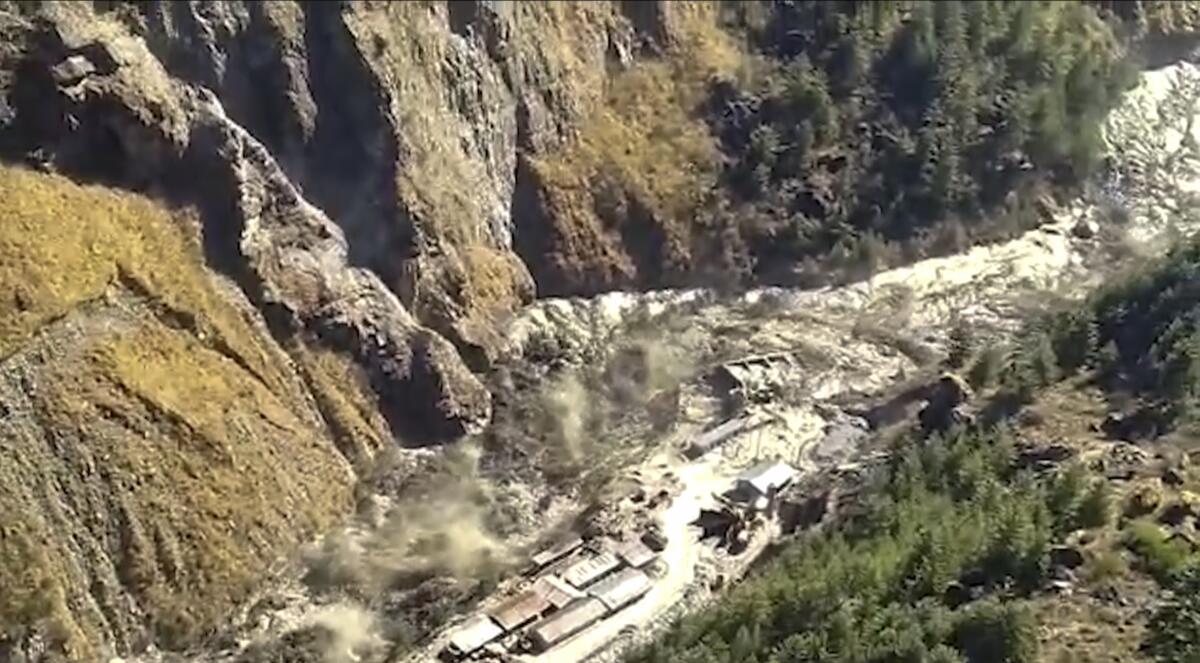 A massive flood of water, mud and debris flowing at Chamoli District.