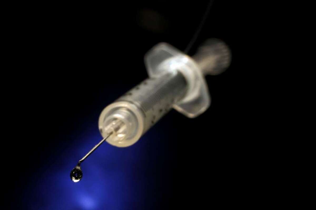 A needle with insulin. 