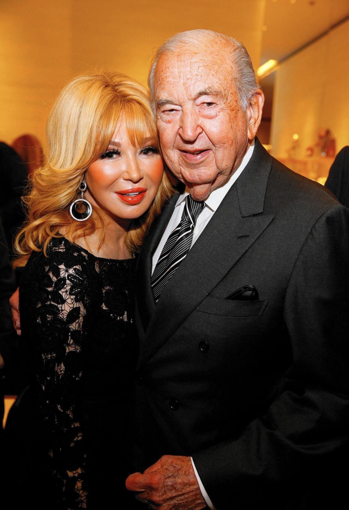 William Lyon, right, shown posing with Elizabeth Segerstrom in 2015, died on Friday.