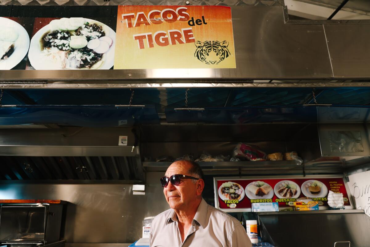 Efrain Ayala at his taco cart Tacos del Tigre. The taquero wants out of the business.