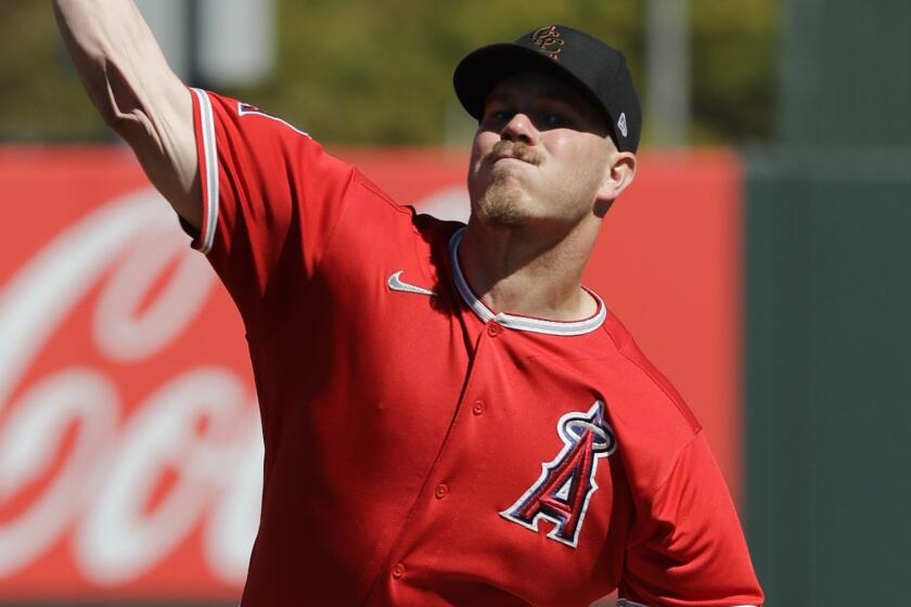 Los Angeles Angels' Dylan Bundy throws during the first inning of a spring training baseball game against the Cincinnati Reds, Tuesday, Feb. 25, 2020, in Tempe, Ariz. (AP Photo/Darron Cummings)