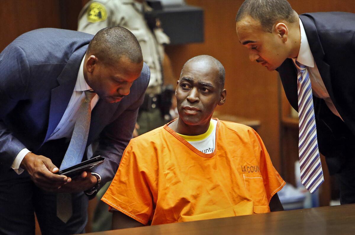 Actor Michael Jace is flanked by his attorneys Peter L. Carr IV, left, and Jason O. Sias during a 2014 proceeding in Los Angeles County Superior Court.