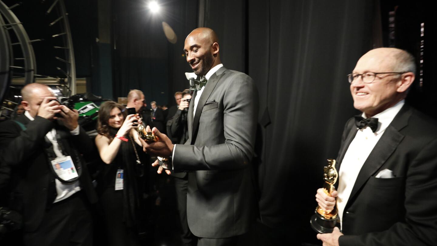 Glen Kean, right, and Kobe Bryant winning best animated short film for "Dear Basketball," from backstage at the 90th Academy Awards on Sunday at the Dolby Theatre in Hollywood.