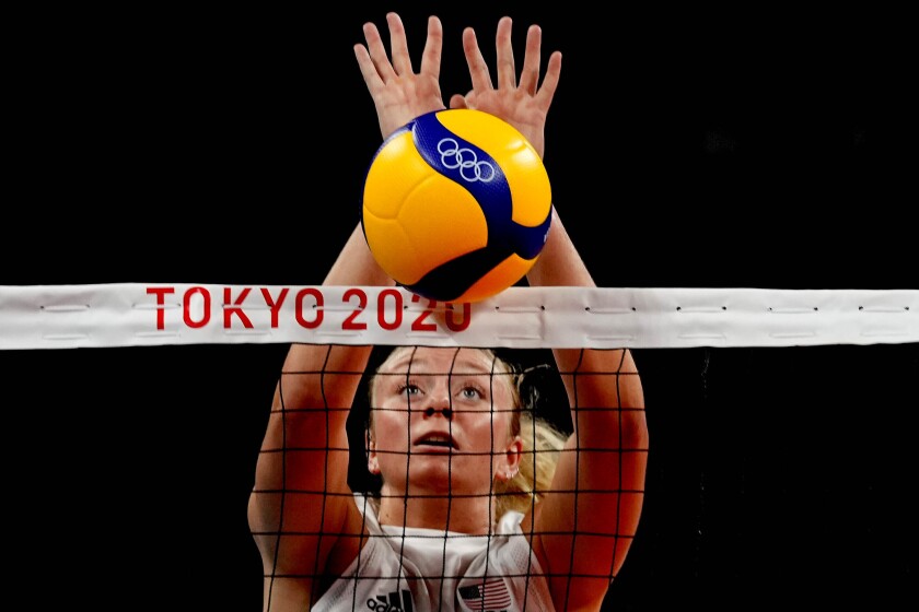 FILE - United States' Jordyn Poulter blocks the ball during the women's volleyball preliminary round at the 2020 Summer Olympics, July 27, 2021, in Tokyo. A stolen Olympic gold medal belonging to Poulter has been found in Southern California, authorities said Wednesday, June 29. Poulter reported the medal stolen May 25 after the Olympian discovered her car broken into at a parking garage in Anaheim, Calif., police said. (AP Photo/Frank Augstein,File)