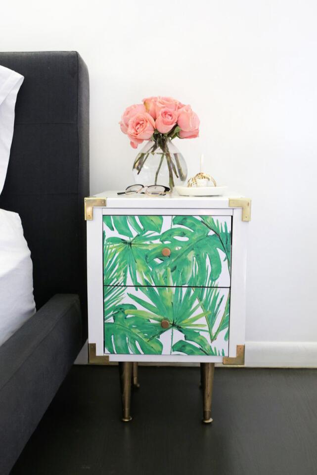 Writer Laura Gummerman transformed a side table with peel-and-stick wallpaper.
