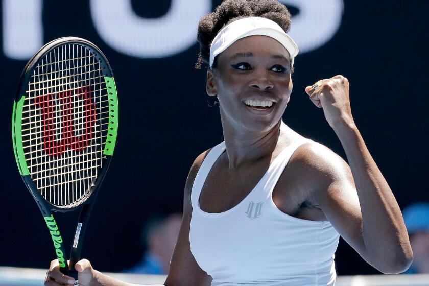 Venus Williams celebrates after defeating Kateryna Kozlova in their first-round match at the Australian Open on Monday.