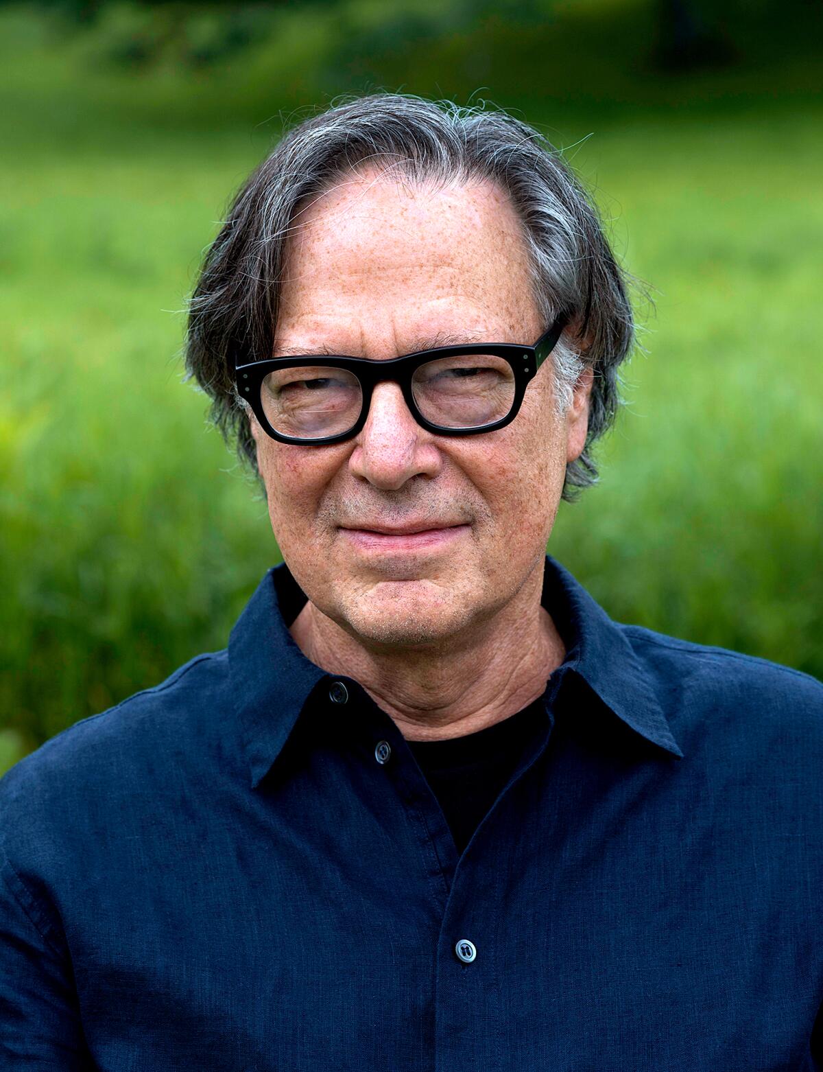Author Philip Gefter wears black-rimmed glasses and a blue collared shirt.