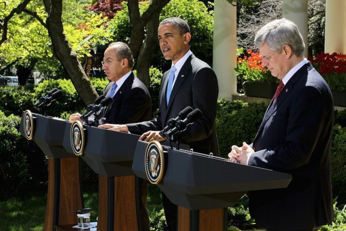 President Obama speaks as Canadian Prime Minister Stephen Harper and Mexican President Felipe Calderon participate in a joint press conference in the Rose Garden of the White House on Monday.