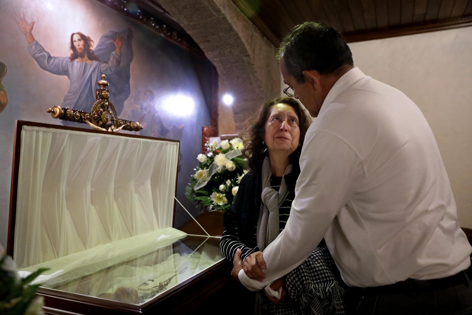 Rosario Tovar Barraza and brother-in-law Hugo Tovar Sanchez at a funeral home in Guadalajara in December.