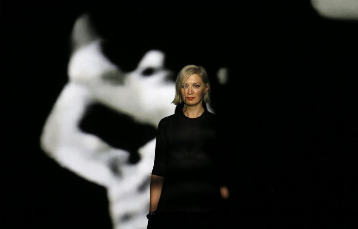 Elizabeth Price, winner of the 2012 Turner Prize, stands with her video installation "The Woolworths Choir of 1979" at the Tate Britain art gallery in London.