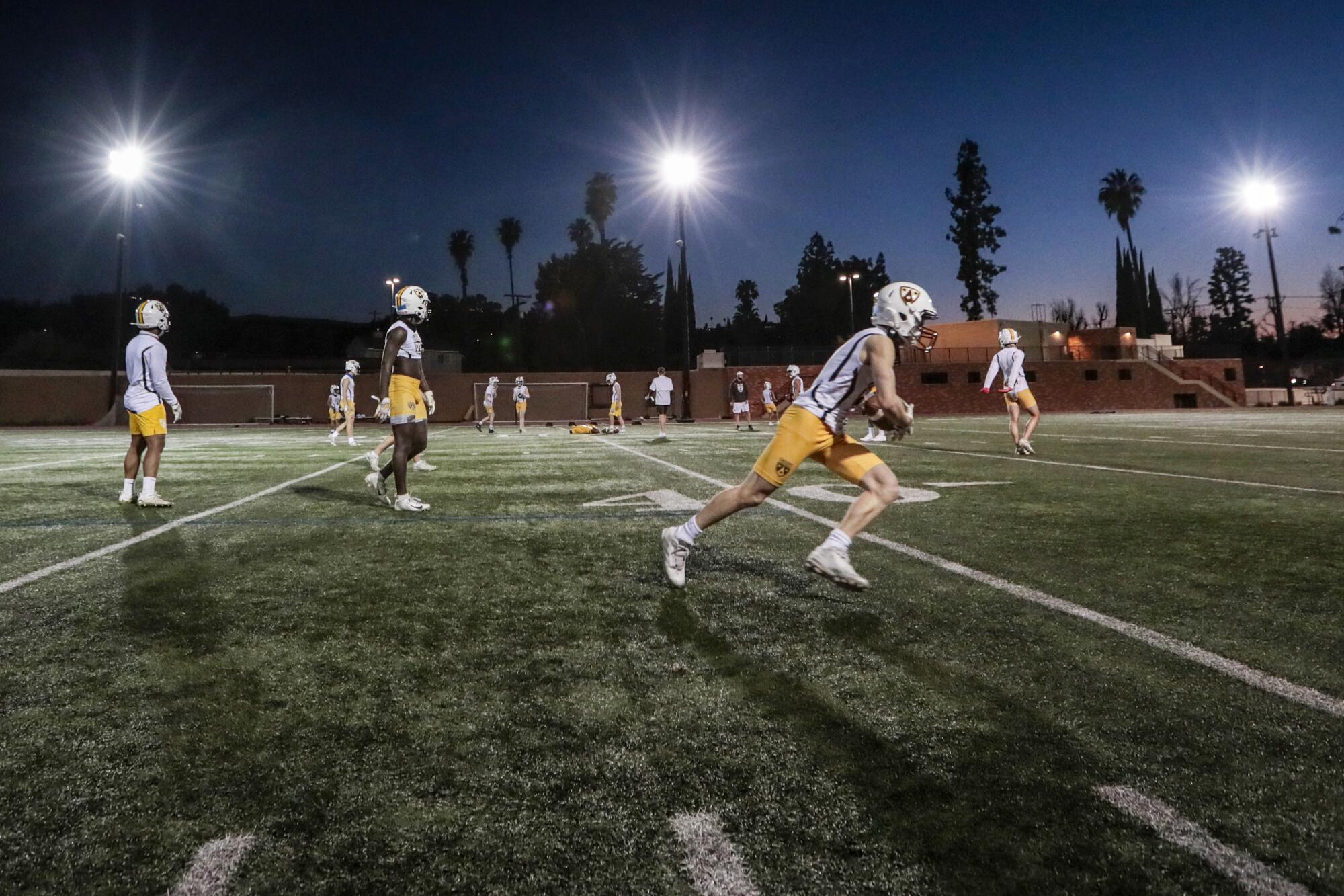 Crespi High School players practice for the first time since COVID-19 restrictions shut down interscholastic sports.