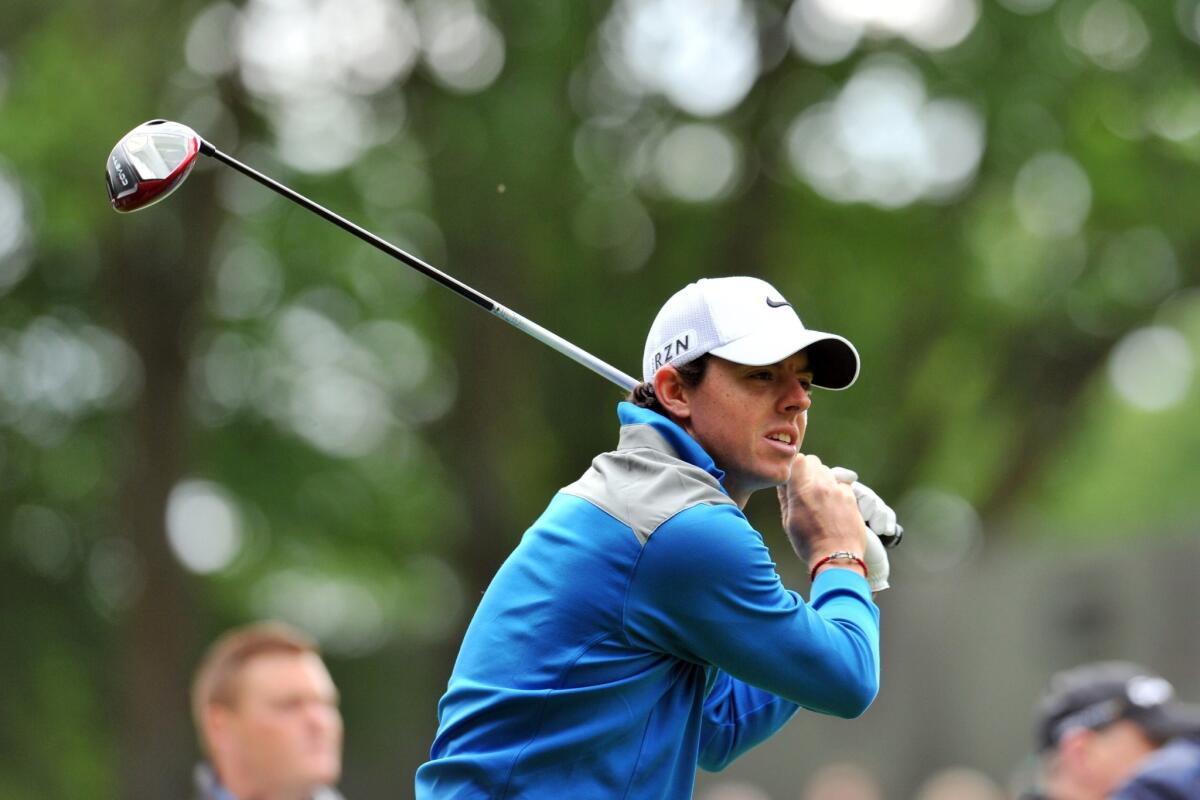 Rory McIlroy watches his drive Friday during the BMW PGA Championship in Surrey, Britain.