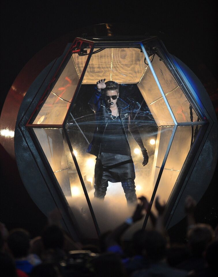 Musician Justin Bieber performs onstage during the 2013 Billboard Music Awards.