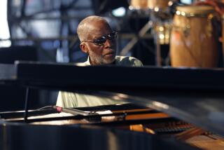 Jazz pianist Ahmad Jamal performs at the Louisiana Jazz and Heritage Festival in New Orleans, Saturday, April 30, 2011. (AP Photo/Gerald Herbert)