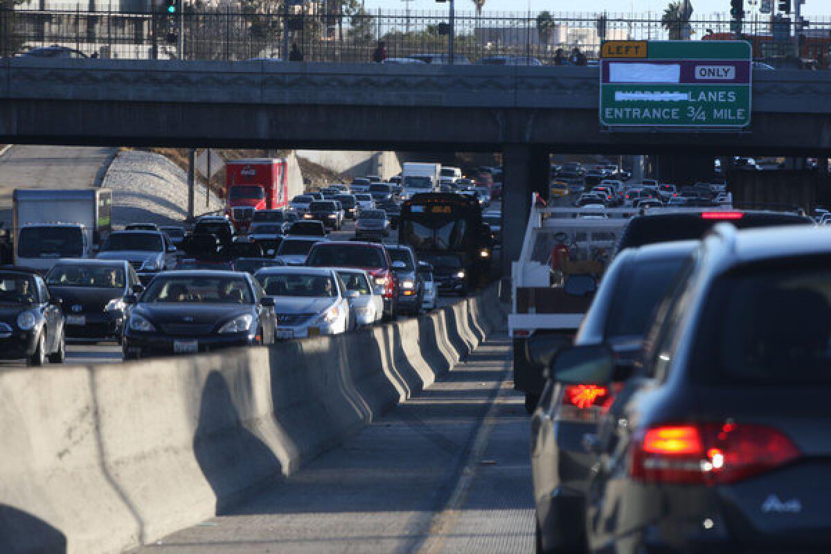 Traffic crawls through downtown Los Angeles on the 110 Freeway. New research shows that in the early morning, air pollution plumes from freeways can travel more than a mile downwind.