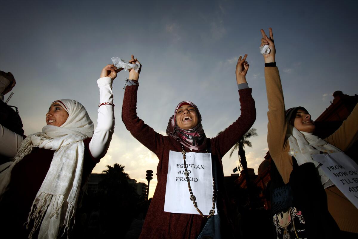 Women celebrate the fall of Egyptian strongman Hosni Mubarak in February 2011.