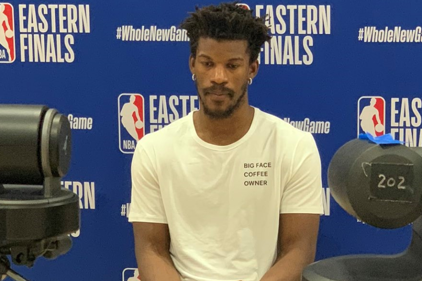 Jimmy Butler speaks to the media wearing a shirt bearing the name of his business, Big Face Coffee.