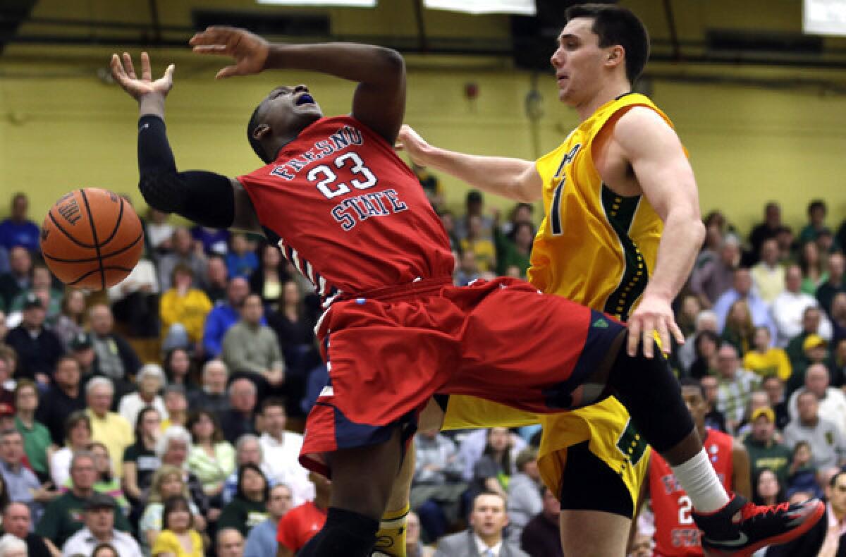 Fresno State's Marvelle Harris (23) is fouled by Siena's Brett Bisping in the second half Wednesday night.