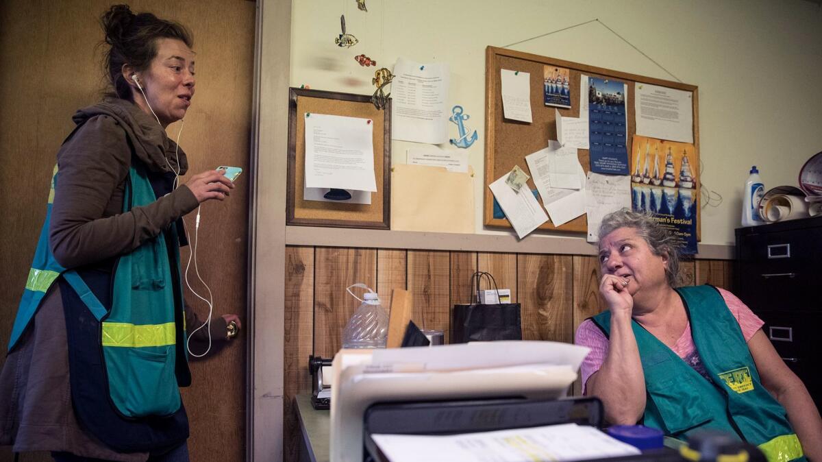 Patty Ginochio, right, and Lira Filippini are helping to provide services to people displaced by the fires at the Bodega Bay Grange community hall.