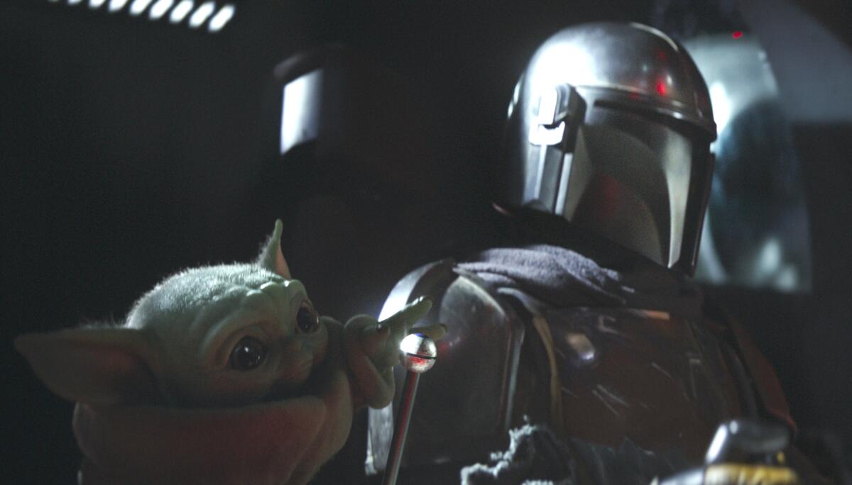 The Child and the Mandalorian in 'The Mandalorian'