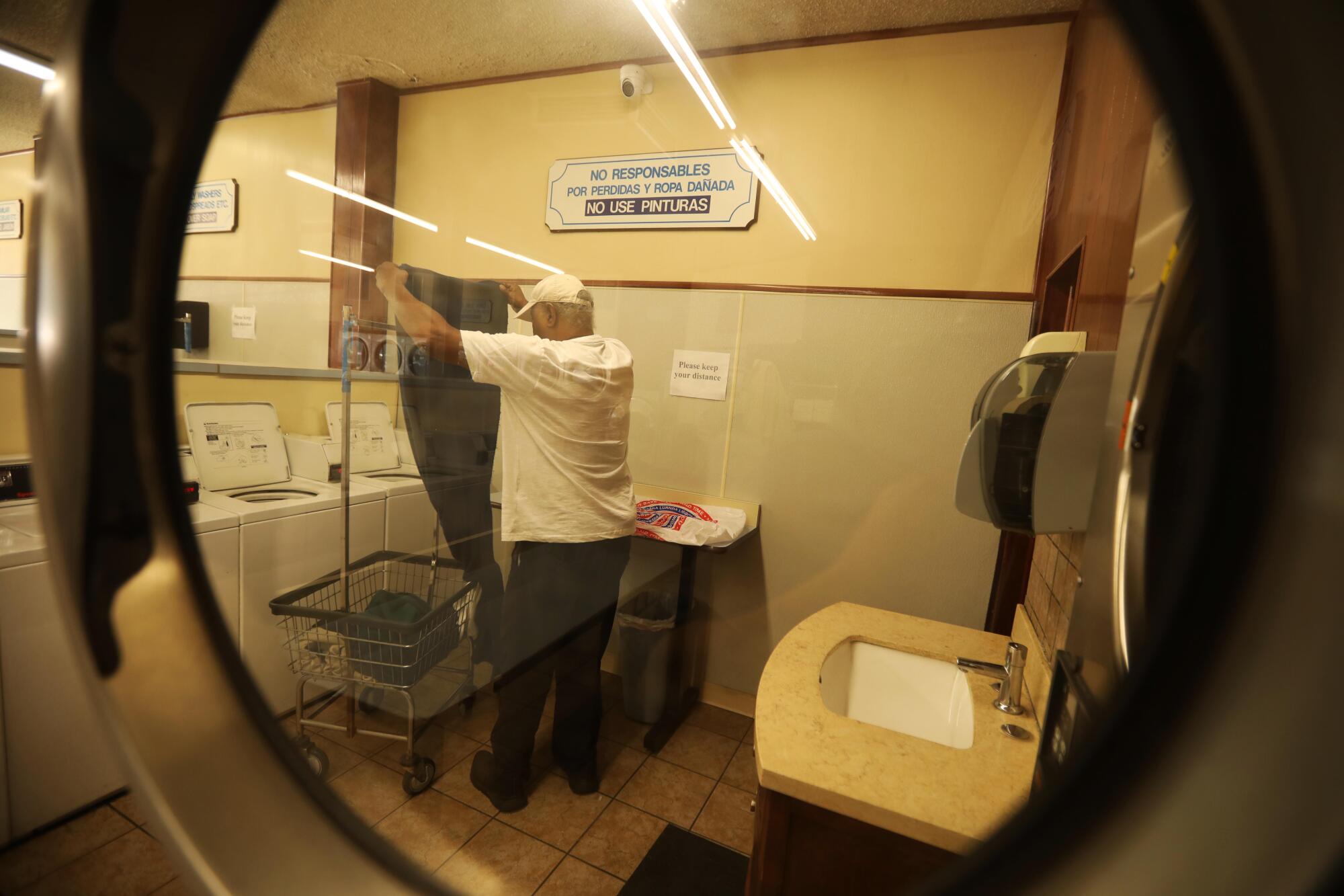 David Mays, who has lived in his car for two years, does his laundry in West Los Angeles. 