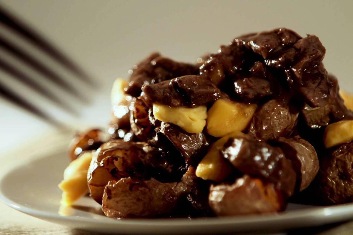 Poutine: fries topped with cheese curds and gravy. Recipe
