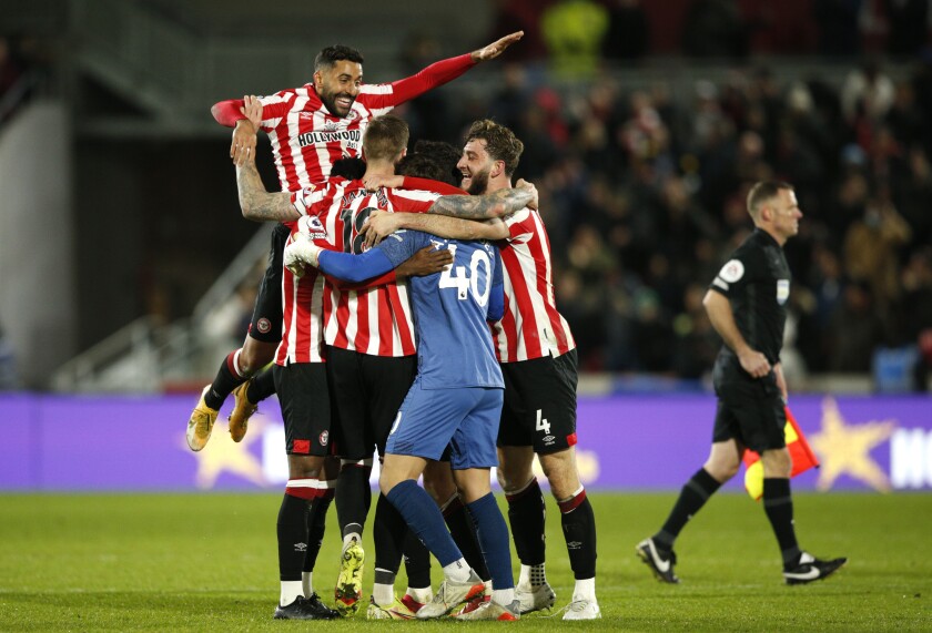 Brentford players celebrate their victory during the English Premier League soccer match between Brentford and Watford, at Brentford Community Stadium, in London, Friday, Dec. 10, 2021. (AP Photo/David Cliff)