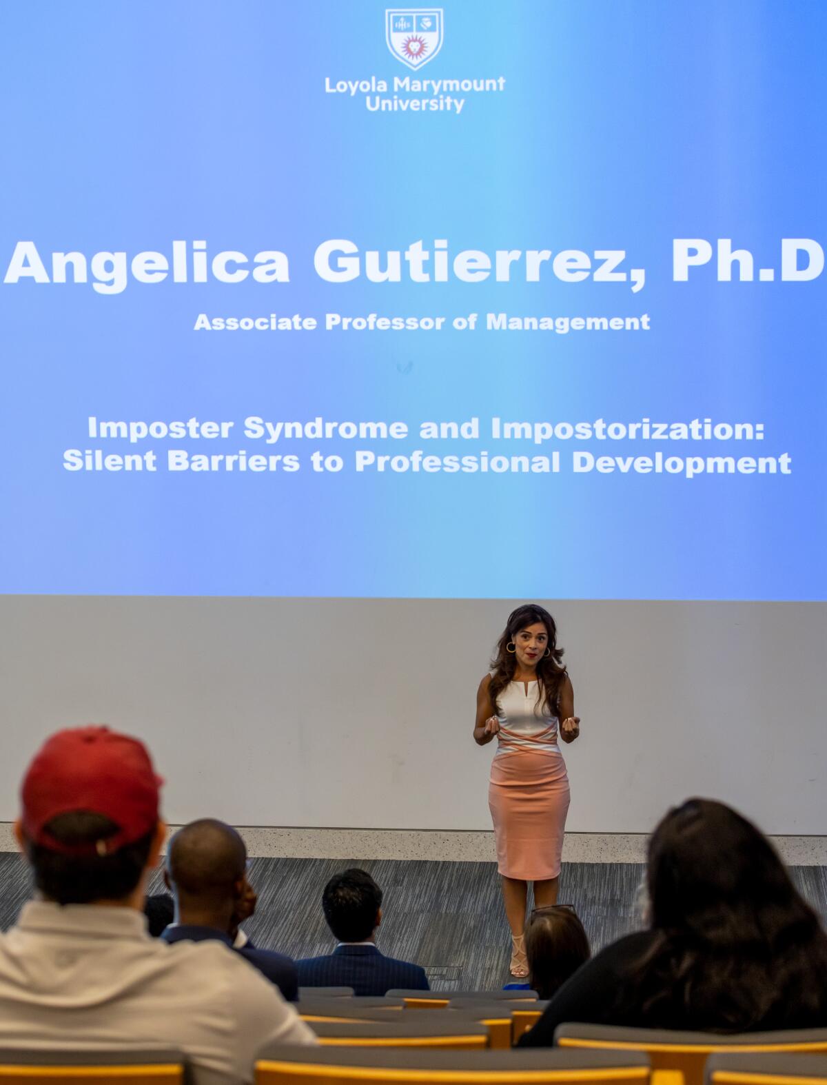 Angelica Gutierrez Ph.D., associate professor of management and leadership, while she speaks about impostor syndrome.