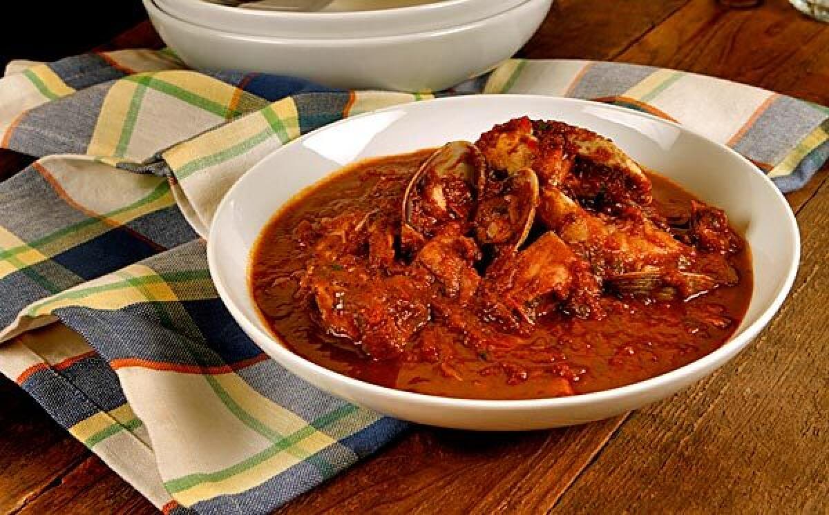 Cioppino basics are wine, tomatoes and assorted seafood.