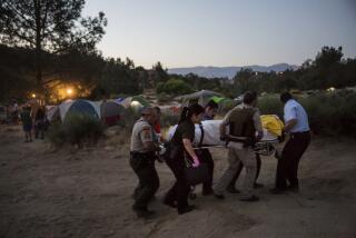 File - LAKE ISABELLA, CALIF. -- SATURDAY, JULY 1, 2017: Kern County Deputy Sherriffs and Search and Rescue workers retrieve a dead body from the Keyesville South area of the Kern River, in Lake Isabella, Calif., on July 1, 2017. (Marcus Yam / Los Angeles Times)