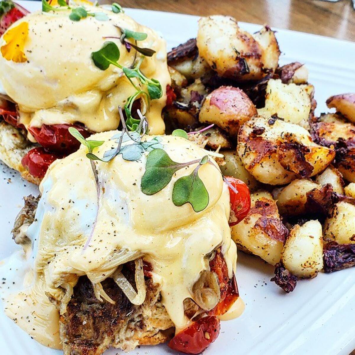 The Carnitas Benny is among brunch options at Break Point Pacific Beach.