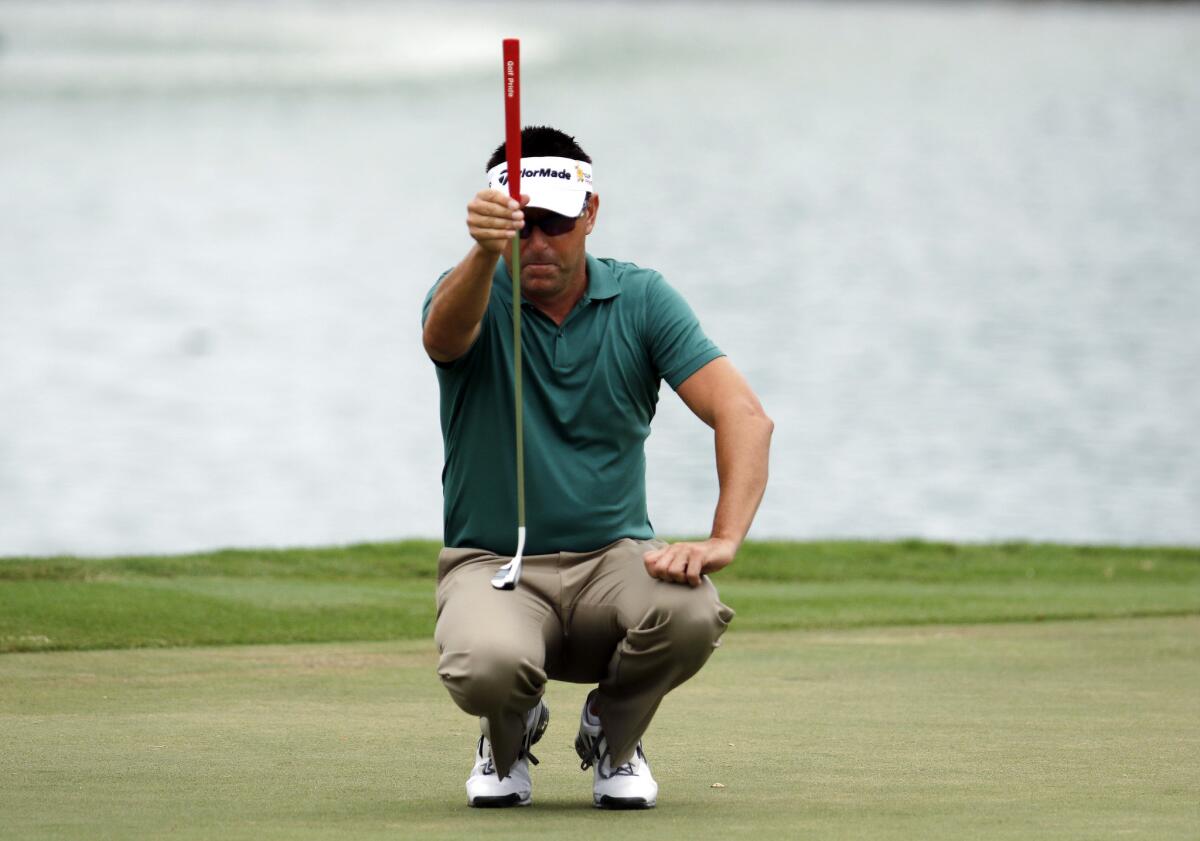 Robert Allenby lines up his ball at the Sony Open in Honolulu on Jan. 16.