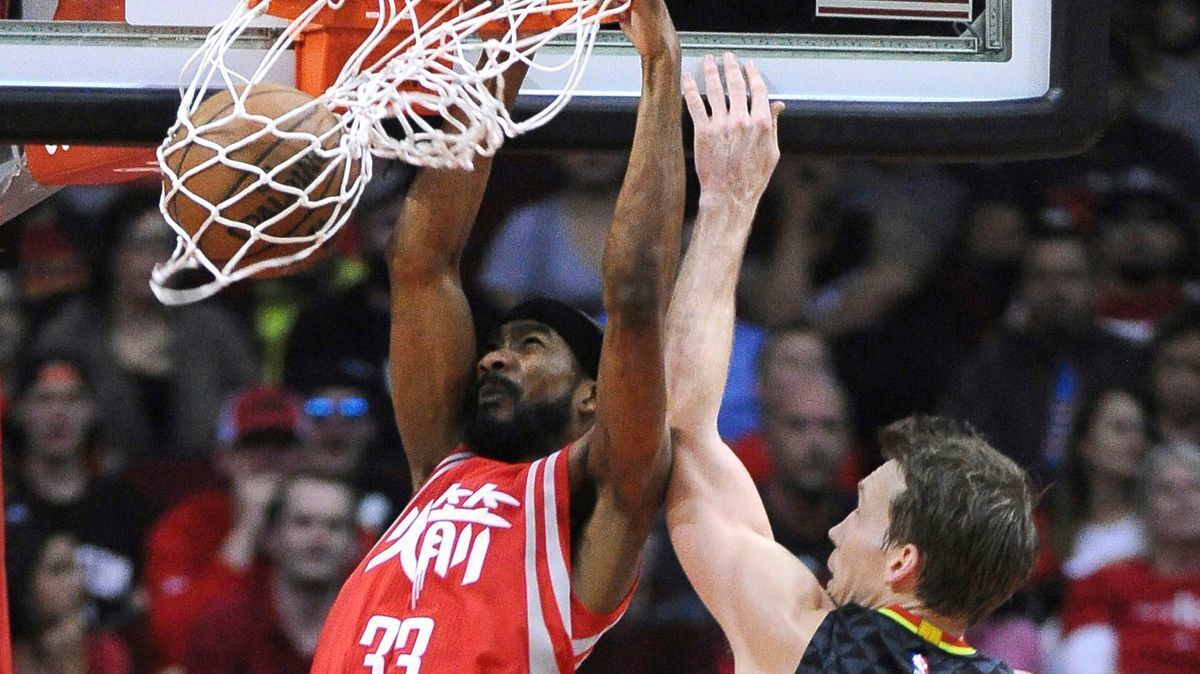 Corey Brewer (33) dunks against Atlanta Hawks guard Mike Dunleavy (34) during the second half on Feb. 2.