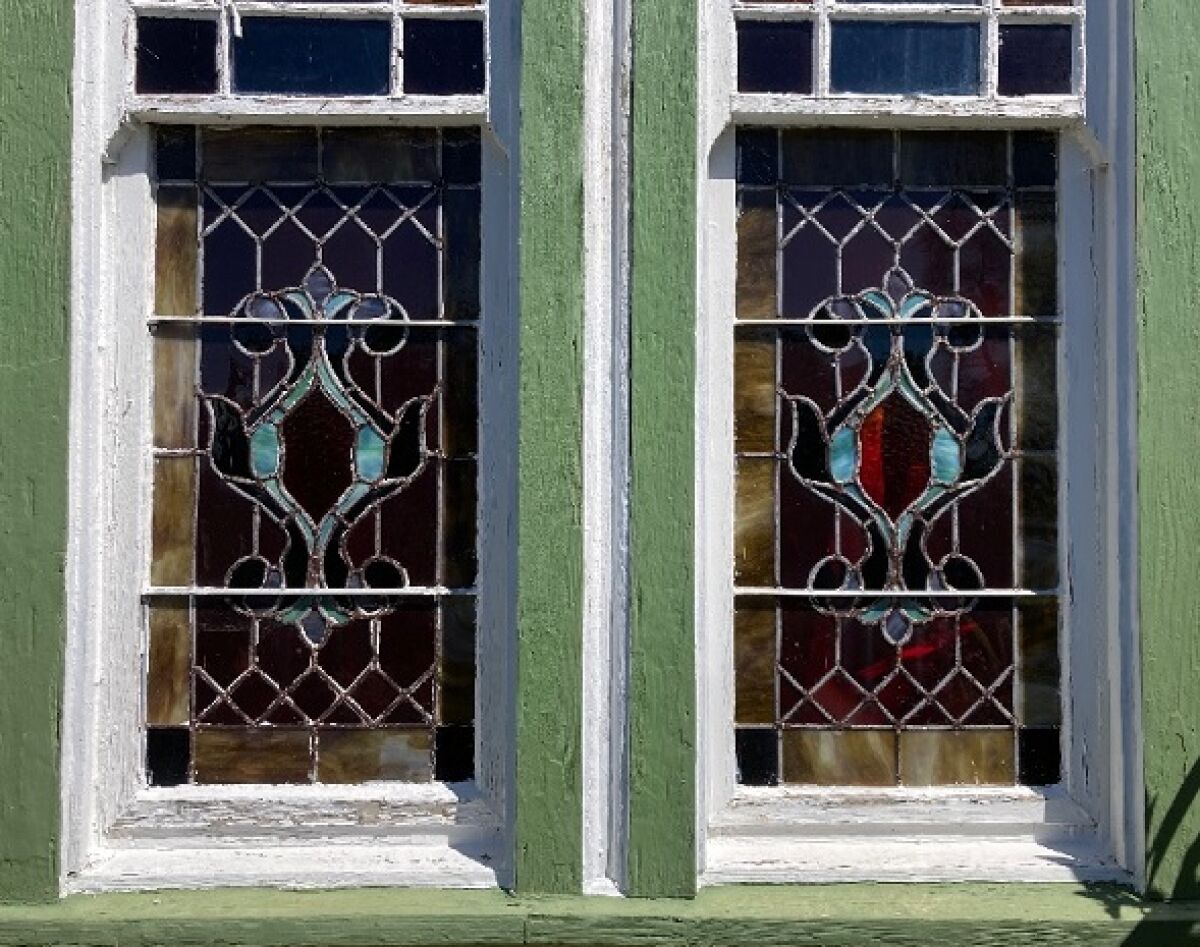 Two stained-glass windows in the front of the Culver House/