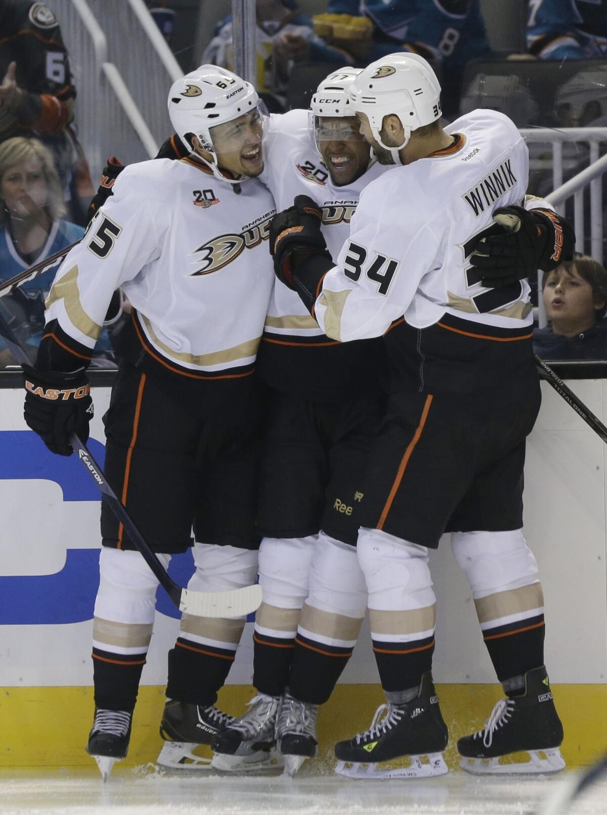 Emerson Etem, left, celebrates with Ducks teammates Devante Smith-Pelly, center, and Daniel Winnik after scoring a second-period goal in the Ducks' 3-2 preseason win over the San Jose Sharks on Friday.