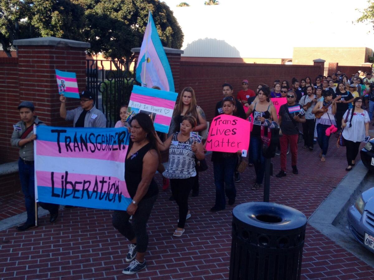 About 120 people march through downtown Santa Ana to remember Zoraida Reyes, whose body was found in a parking lot behind an Anaheim restaurant.