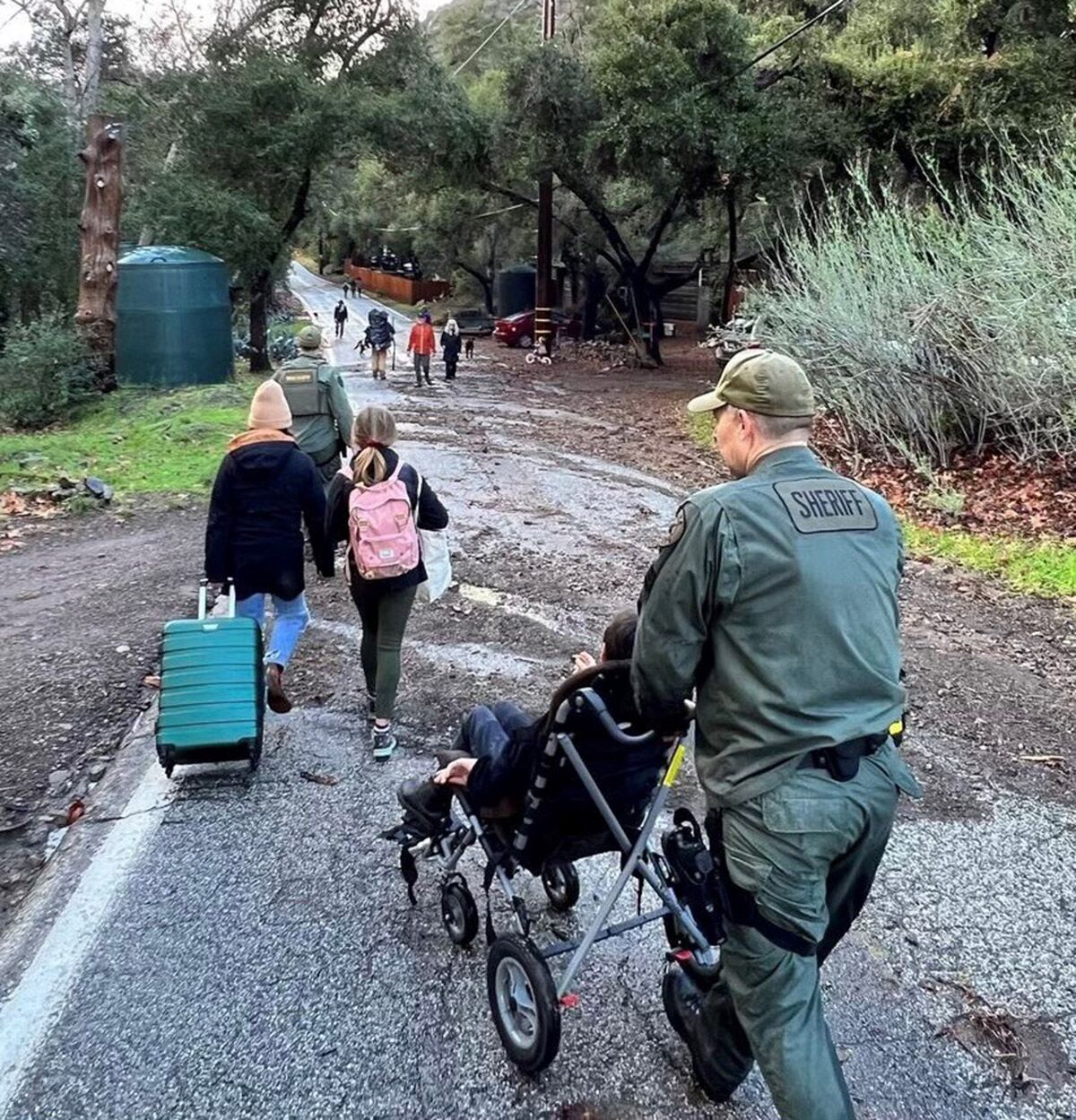 Ventura County Sheriff's deputies aid Matilija Canyon Residents in evacuation due to the rainfall. 
