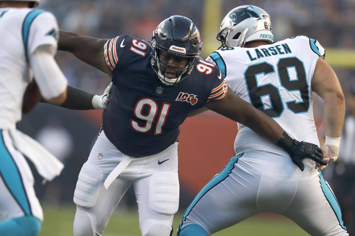 FILE - Chicago Bears nose tackle Eddie Goldman breaks through the Carolina Panthers offensive line during the first half of an NFL preseason football game, Thursday, Aug. 8, 2019, in Chicago. The Atlanta Falcons acquired run-stopping help for the middle of their defensive line on Wednesday, July 6, 2022, by signing former Chicago Bears nose tackle Eddie Goldman to a one-year deal. (AP Photo/Amr Alfiky, File)
