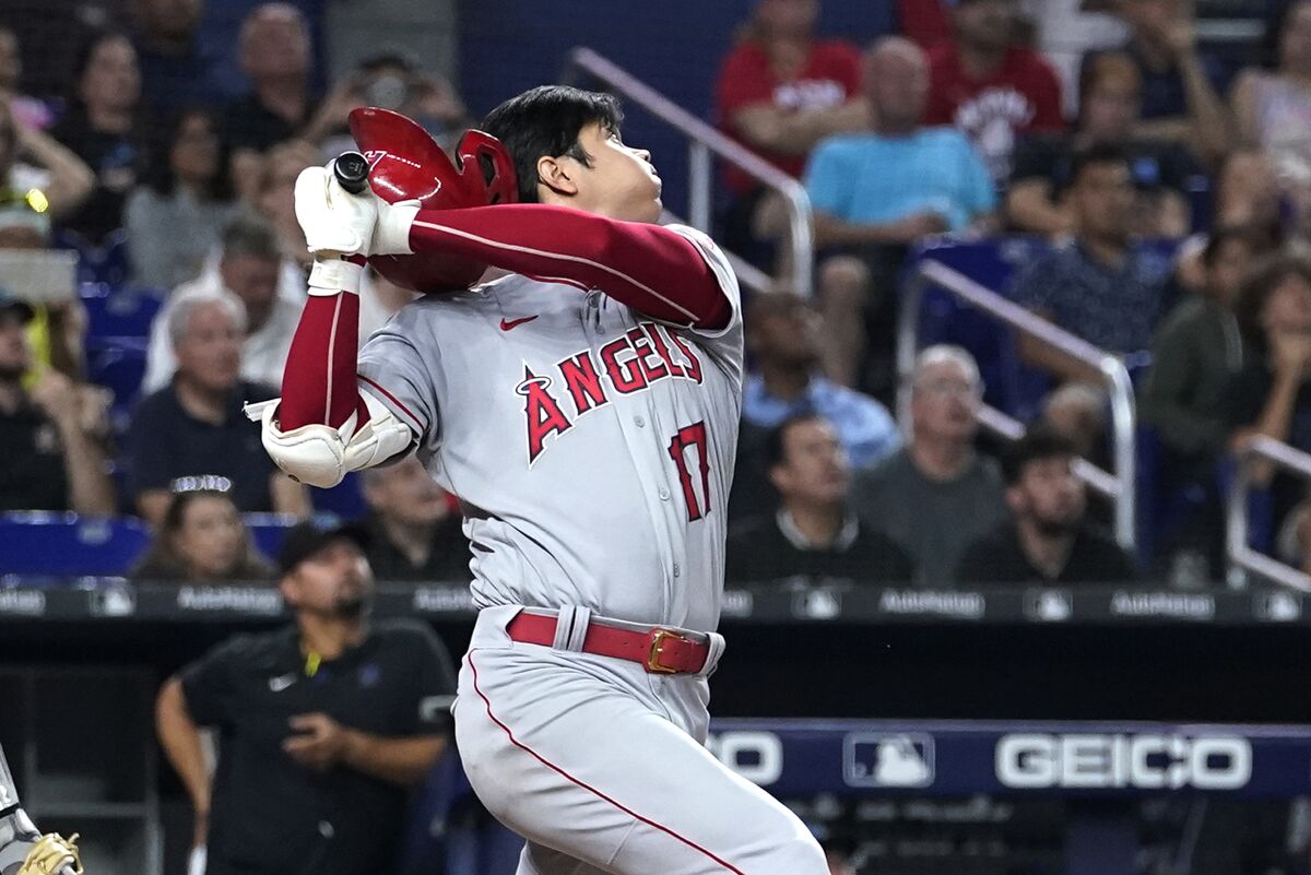Los Angeles Angels' Shohei Ohtani loses his helmet while batting during the fifth inning of the team's baseball game against the Miami Marlins, Wednesday, July 6, 2022, in Miami. (AP Photo/Lynne Sladky)