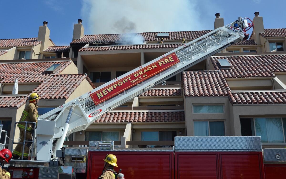 Firefighters at the apartment complex Sunday.