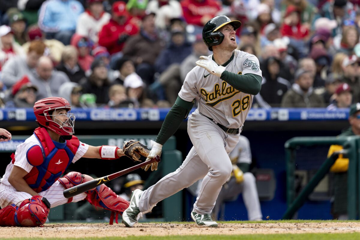 Oakland Athletics' Billy McKinney follows through on a home run during the seventh inning of a baseball game against the Philadelphia Phillies, Sunday, April 10, 2022, in Philadelphia. (AP Photo/Laurence Kesterson)