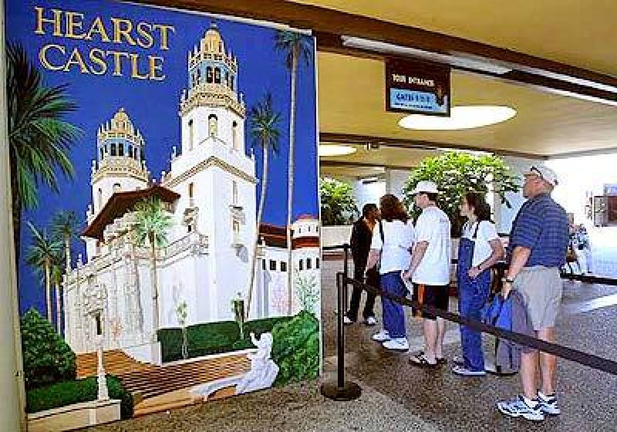 Tourists wait to ride a bus up the hill to tour Hearst Castle in San Simeon on the Central Coast.