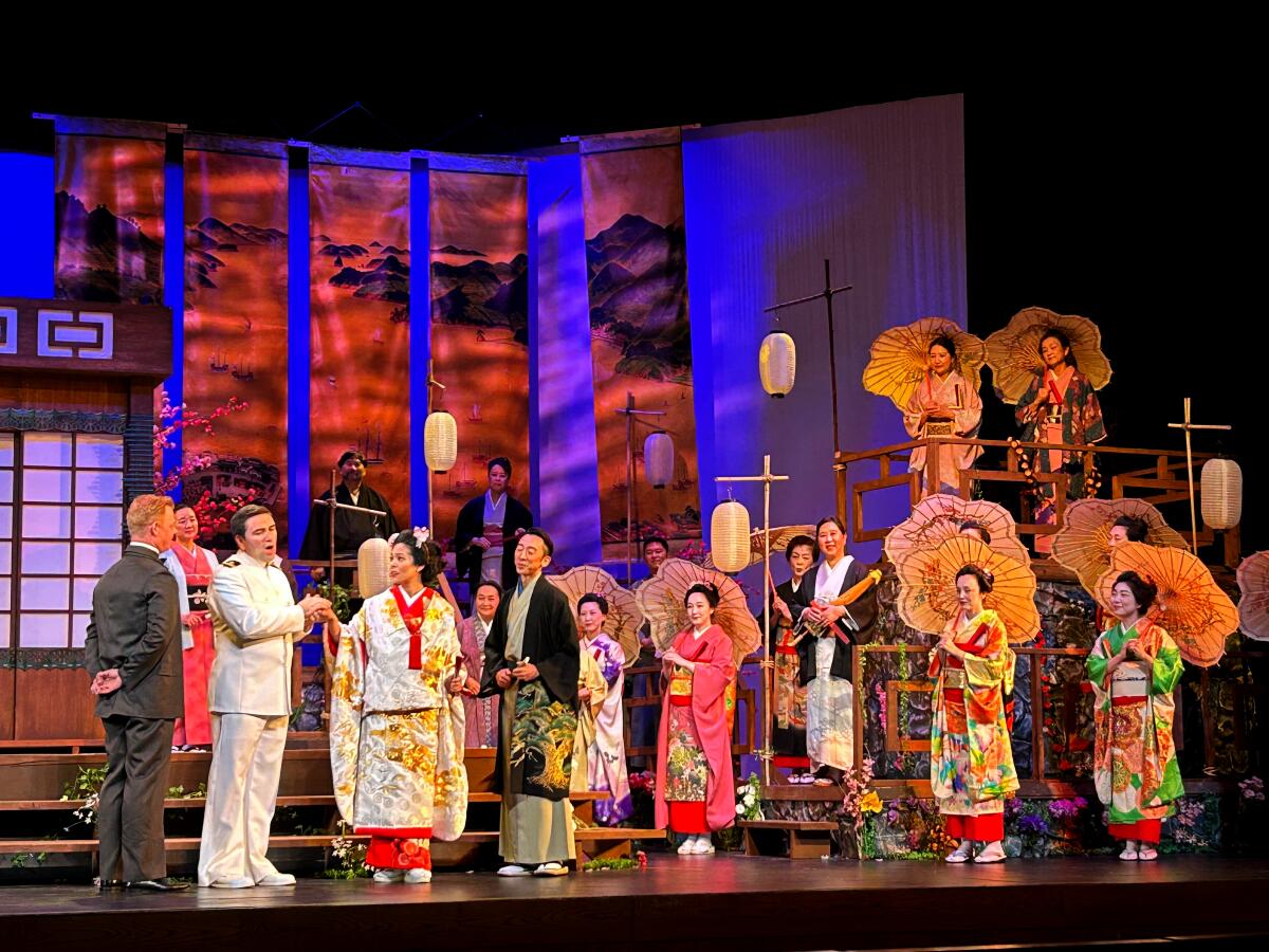Pacific Opera Project "Madama Butterfly" with several people in colorful costumes and parasols