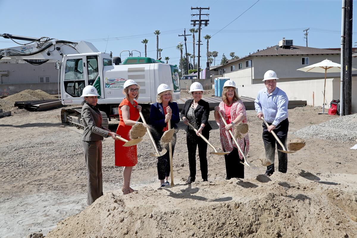 Dignitaries at a groundbreaking ceremony for Huntington Beach Seniors on Wednesday.