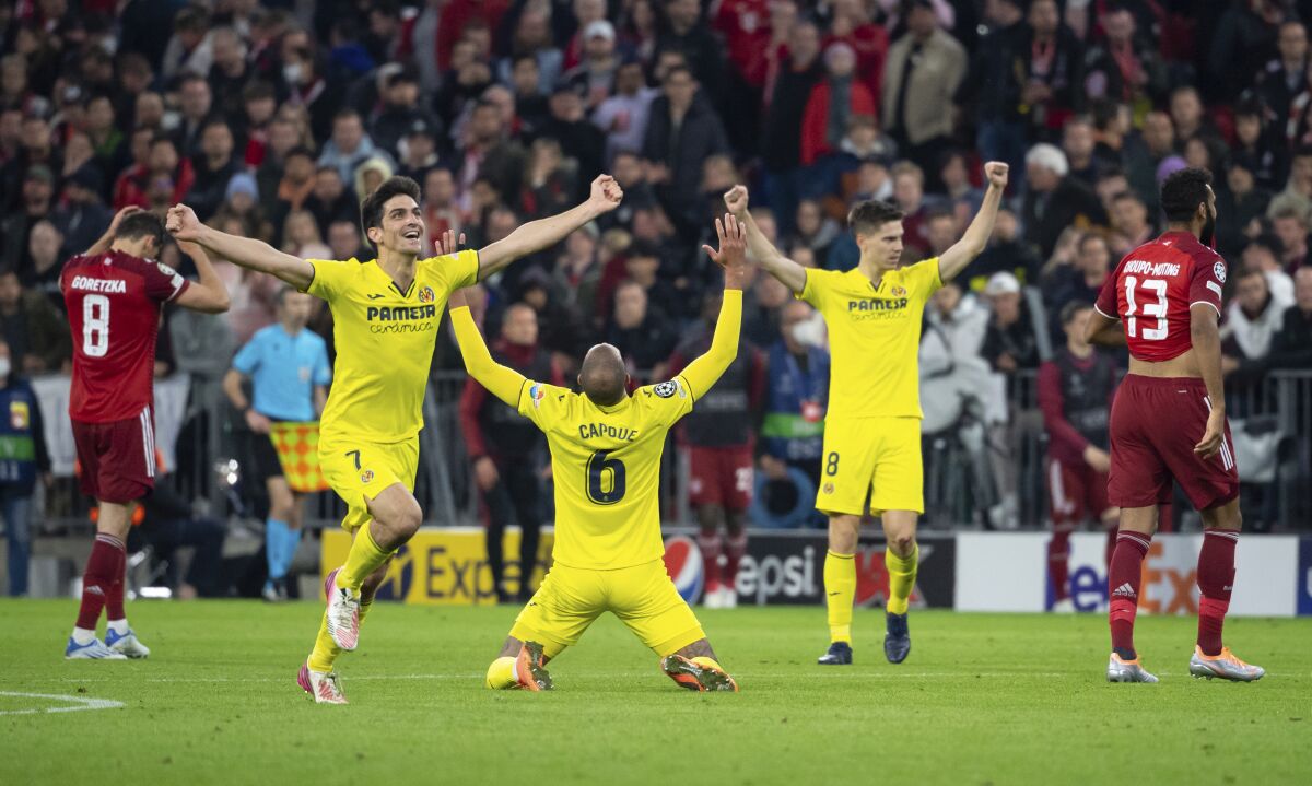 Villareal players celebrate end of the Champions League, second leg, quarterfinal soccer match between Bayern Munich and Villareal at the Allianz Arena, in Munich, Germany, Tuesday, April 12, 2022. (Sven Hoppe/DPA via AP)
