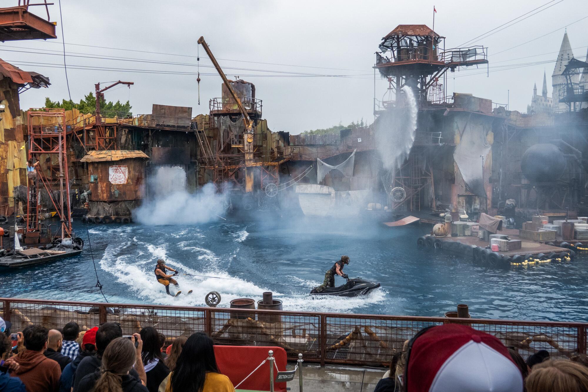Waterworld show at Universal Studios featuring a man on skis being pulled by a jetski.