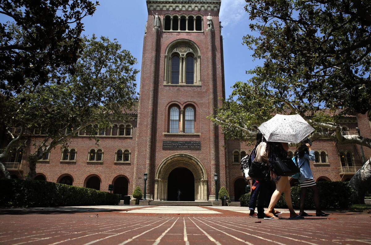 Students walk on the campus of the University of Southern California.