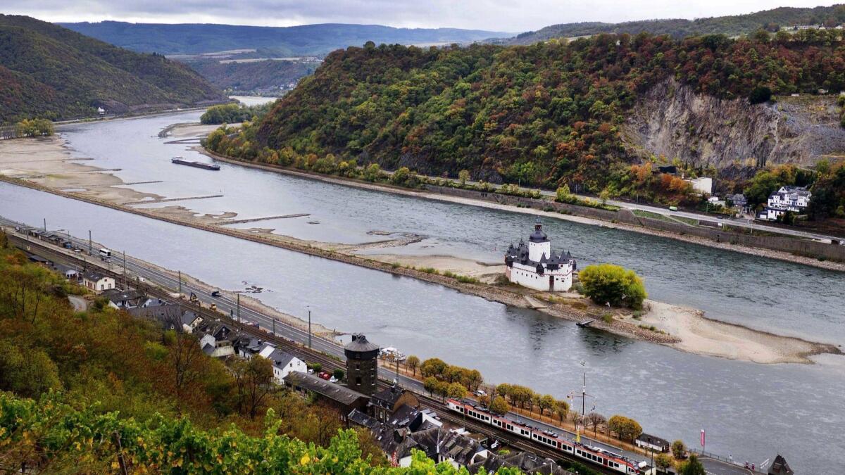 The Pfalzgrafenstein castle from the 14th century sits on a sandbank in the Rhine in Kaub, Germany, during historically low water levels.