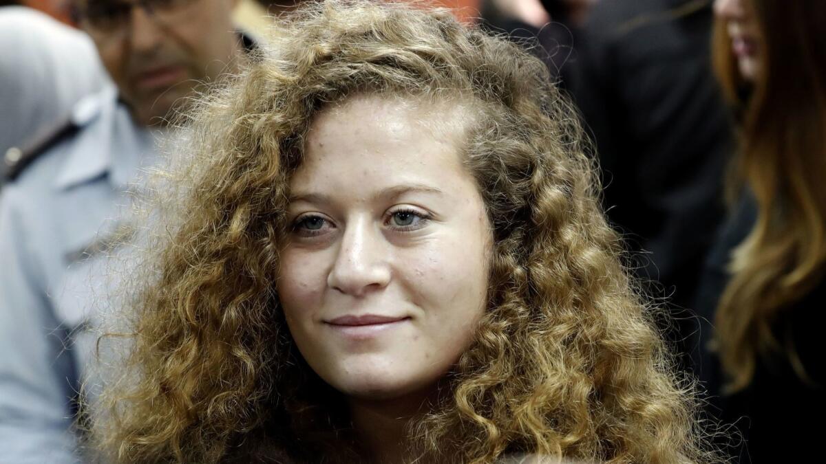 Ahed Tamimi arrives for the beginning of her trial in the Israeli military court at Ofer military prison in the West Bank village of Betunia on Feb. 13.